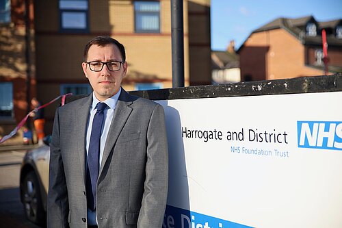 Tom Gordon by an NHS sign at Harrogate District Hospital