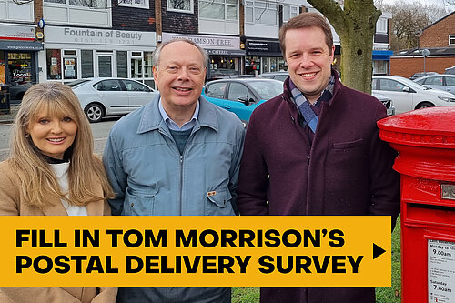 Tom Morrison with local councillors stood next to post box