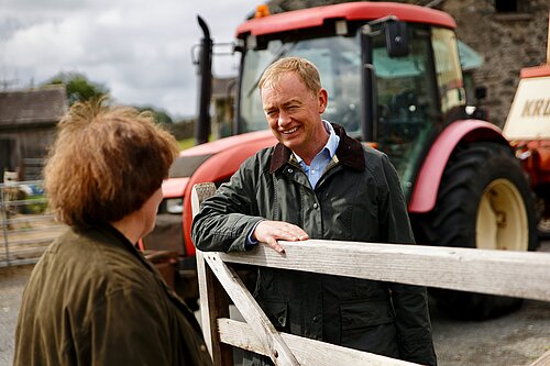 Tim listening to a farmer