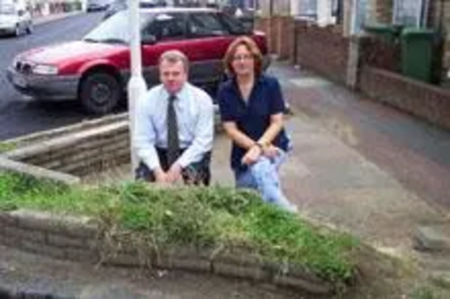 Peter Carroll and Tessa Caruana with one of the overgrown gardens