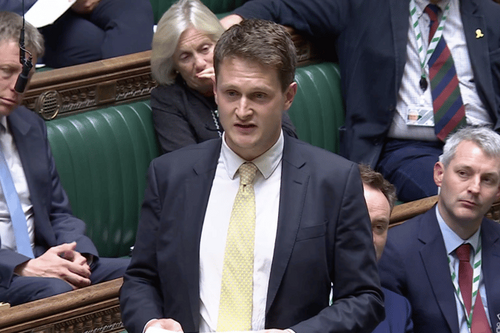 Headshot of David speaking in Parliament