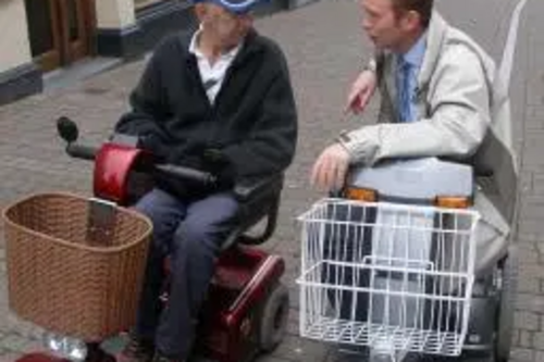 Tim Farron MP on a fact-finding mission with a wheelchair user