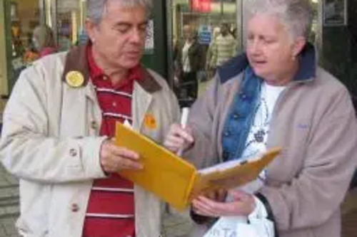 Cllr Mike Mackrory signs up a local resident to back a Greener Chelmsford