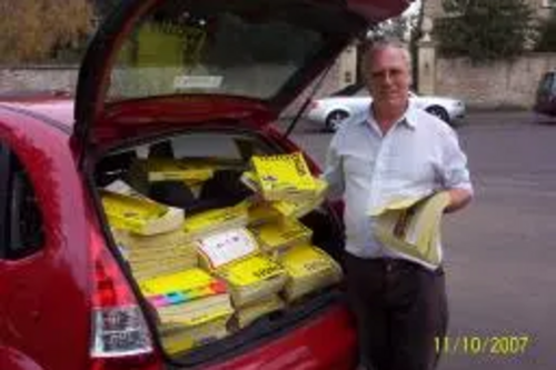 a car full of yellow pages for recycling