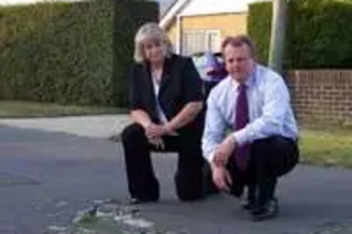 Ann Birchmore and Peter Carroll on an unadopted road in Littlestone