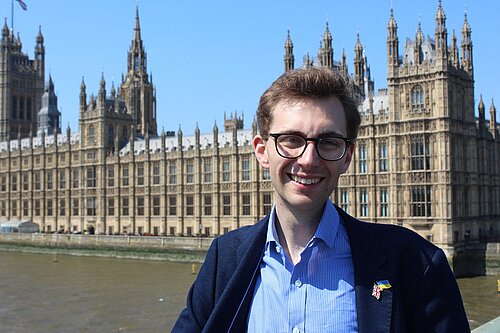 Photo of Jack Clark with Westminster in the background.