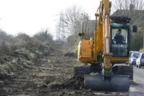 Digger / bulldozer clearing site