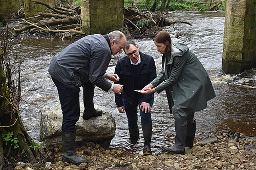 Tom Gordon with Ed Davey MP and Cllr Hannah Gostlow taking samples from the River Nidd to check for E Coli bacteria and sewage