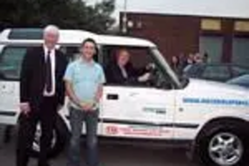 IN THE HOTSEAT - Sir Menzies Campbell MP drives the peace wagon with Peace Campaigner John Farrington and Paul Rowen MP.