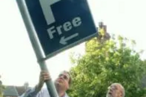 Tom McNeice and Darren Briddock with broken parking sign