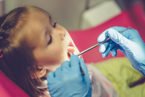 child at the dentist having a dentistry check up