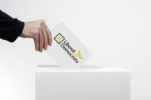 A liberal democrat ballot going into a ballot box.